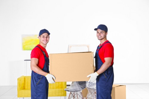 Packed moving boxes and furniture ready for removals in Ruxley