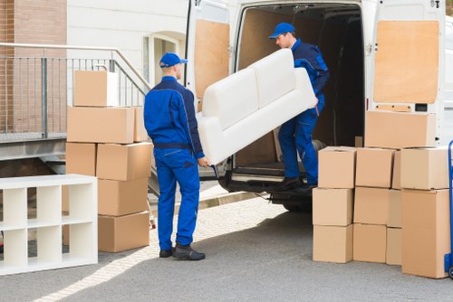 Packed boxes and furniture ready for temporary storage in Ruxley