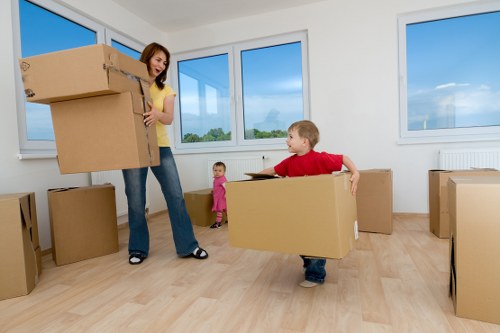 Packed self storage unit in Ruxley with labeled boxes and furniture