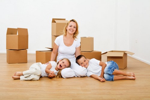 Packed essentials and labeled boxes for a house move in Ruxley