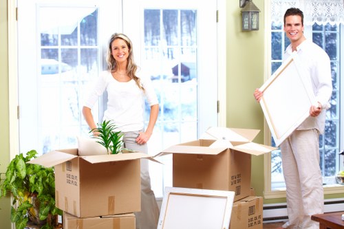 Local moving team handling furniture during removals in Ruxley